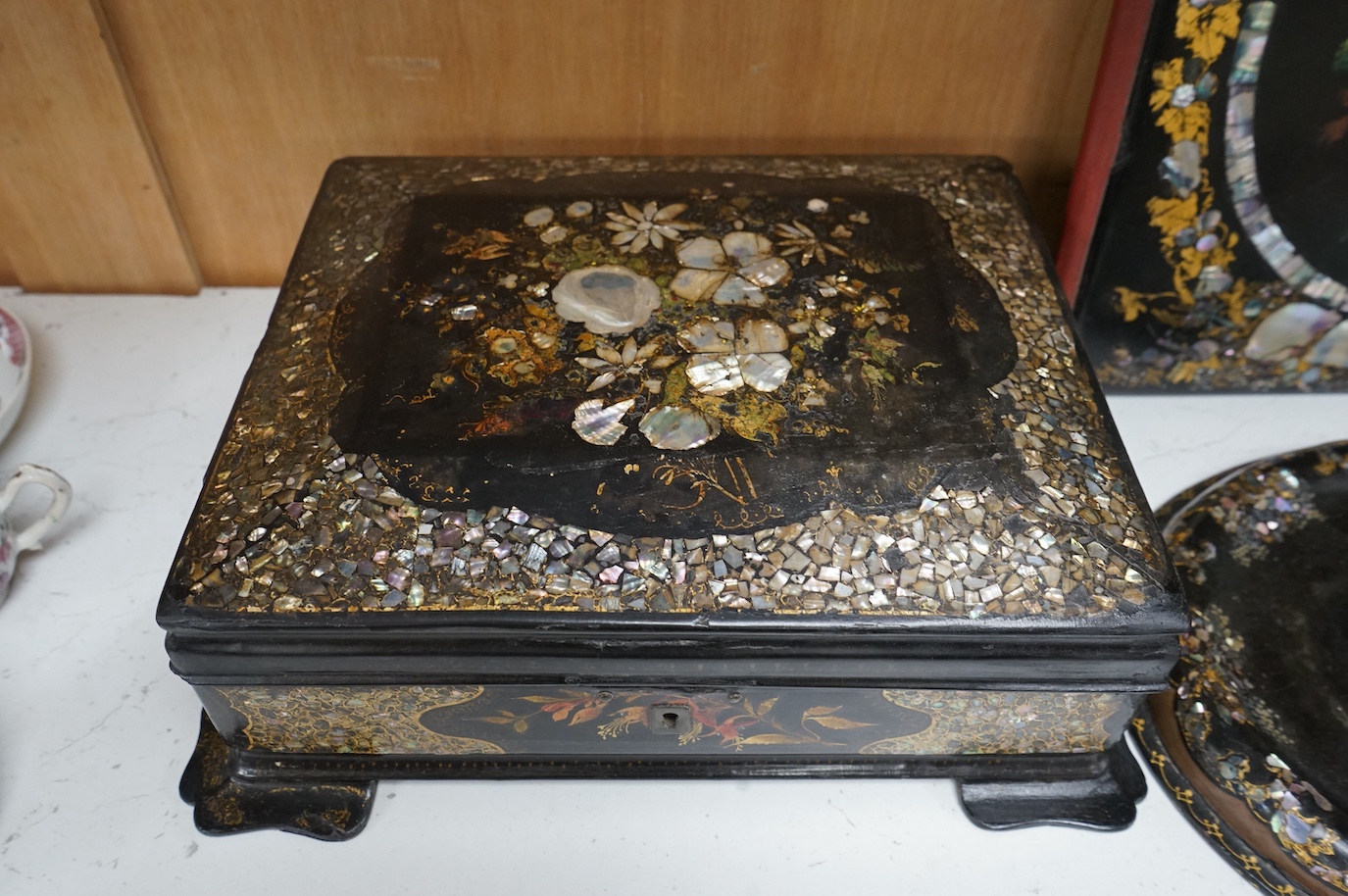 A group of Victorian japanned papier-mâché desk items and boxes (5). Blotter 24cm wide x 31cm high